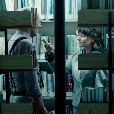 A man and a woman in a library