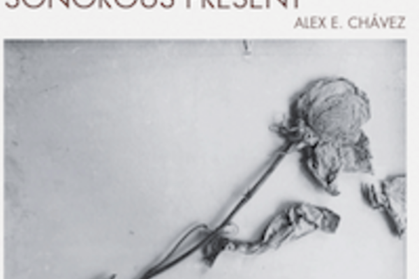 Album cover entitled Sonorous Present with a black and white photo of a dried and slightly pressed light-colored rose