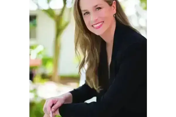 Women smiling with black blazer