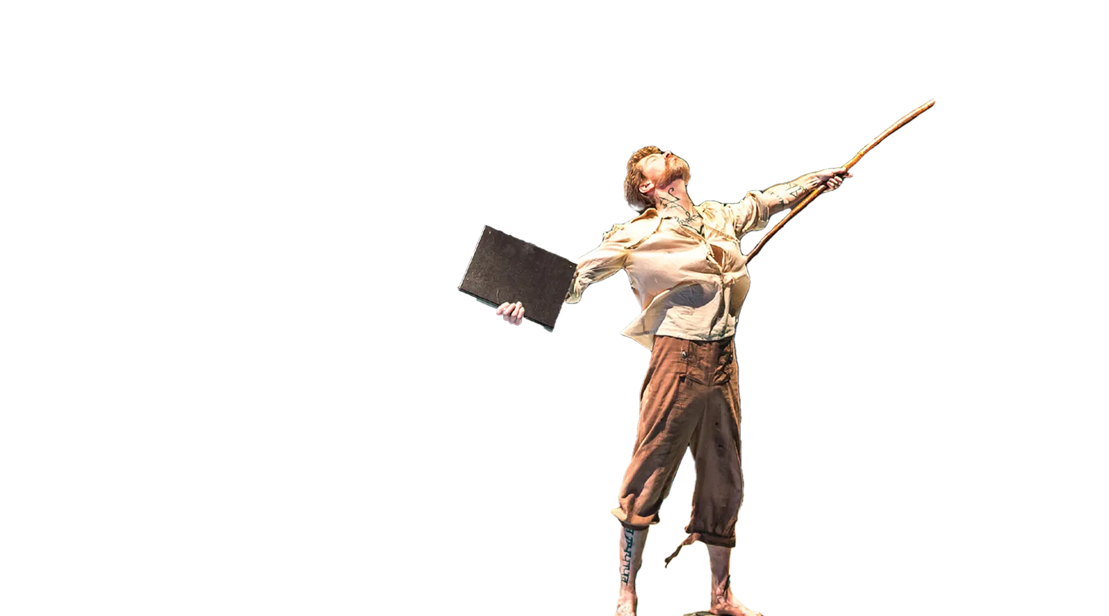 An actor standing with arms wide and head back while holding a book and long stick